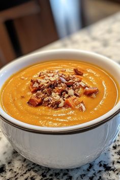 Creamy butternut squash soup topped with chopped pecans in a white bowl on a granite countertop. Starters For Dinner, Potato Soup Easy, Soup Easy