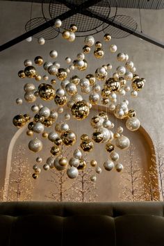 a large chandelier hanging from the ceiling in a room filled with christmas decorations