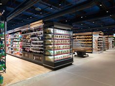 an empty grocery store filled with lots of food and drink bottles in it's shelves