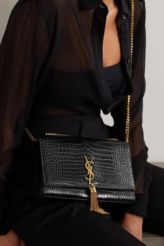 Find SAINT LAURENT Kate Croc-effect Glossed-leather Shoulder Bag on Editorialist. SAINT LAURENT's 'Kate' bag is one of the brand's most popular styles and it's easy to see why - the sleek '90s-inspired baguette shape and gilded gold-tone hardware make it a perfect option for day or night. Made in Italy from croc-effect glossed-leather, it has a slim chain strap and generously sized interior that's perfect for securing your phone, cardholder and a lipstick. Wear it with: [SAINT LAURENT Shirt id1210354], [SAINT LAURENT Shorts id1239059]. Saint Laurent Shirt, Ysl Handbags, Kate Bags, Bag Outfit, Louis Vuitton Crossbody, Latest Bags, Trending Handbag, Saint Laurent Bag, Popular Style