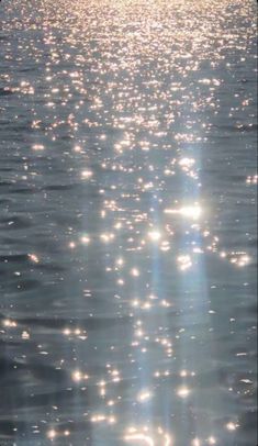 the sun shines brightly on the water as it reflects off the surface in this photo