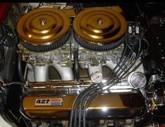 an image of a car engine that is gold