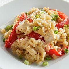 a white plate topped with rice and vegetables