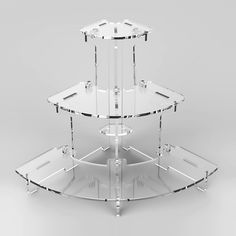 three tiered clear glass display stand on grey background