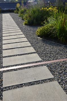 a walkway made out of stones and gravel