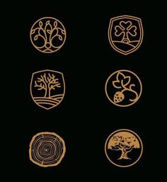 four different types of badges on a black background, each with an animal and tree in the center