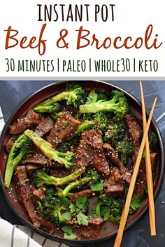 beef and broccoli stir fry in a pan with chopsticks on the side