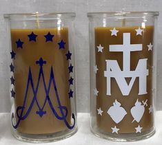 two candles that are sitting next to each other