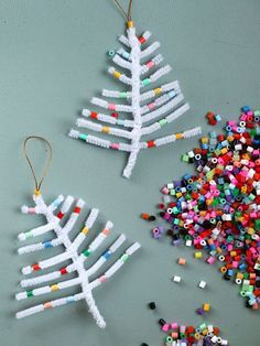 two christmas tree ornaments made out of beads