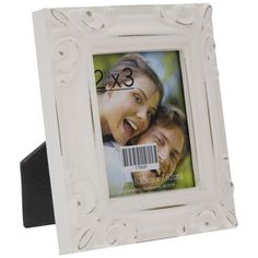 a white photo frame with the number 3x5 on it and an image of two people