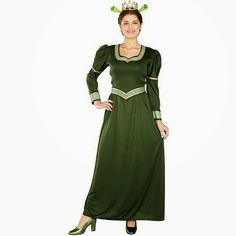 a woman in a green dress with a crown on her head and hands on her hips