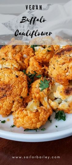 cauliflower is shown on a plate with parsley in the middle and text vegan buffalo grilled cauliflower