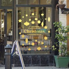 the front window of a store that sells christmas decorations