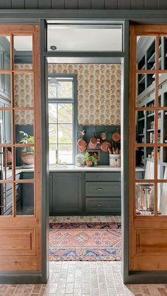 an open door leading to a kitchen area