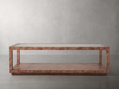 a coffee table made out of wood and glass with no top on the bottom shelf