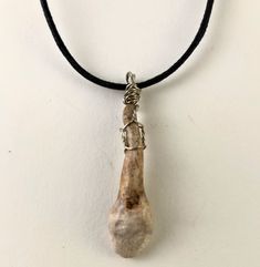 This tooth was hand-sculpted with mixed media. The tooth was then painted / finished with a patina and varnished for durability. To give this pendant a more industrial and cinematic feel, unconventional components were used.  The tooth itself measures approximately 1 1/4"long. The black woven cotton cord is 1mm thick and is adjustable with dual sliding knots to offer multiple length options. Saw Movie, Teeth Necklace, Tooth Pendant, Human Teeth, Tooth Necklace, Sliding Knot, Movie Props, Cotton Cord, Woven Cotton