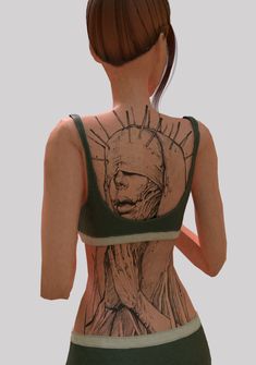 a woman with her back to the camera, wearing a green top that has an image of a statue of liberty on it