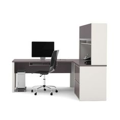 an office desk with a computer monitor on top of it, and a white cabinet next to it