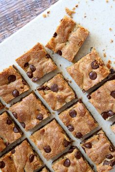 chocolate chip cookie bars cut into squares on a cutting board