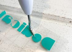 a close up of a metal object with the word fabric painted on it and a drill