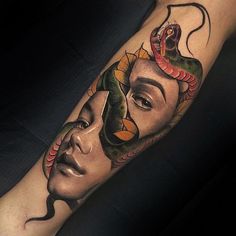 a woman's face with a snake on her head and the other side of her arm