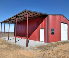 a red metal building with two doors on the side