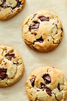 chocolate chip cookies on parchment paper lined up