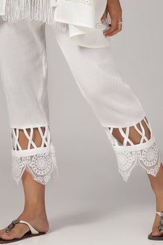 White top with thread, sequin, beads and cutwork embroidery in geometric pattern. Paired with matching slim fit pant. - Aza Fashions Elegant Stretch Pant Set For Spring, Elegant White Bottoms With Lace Work, Elegant Stretch Sets With Long Pants, Elegant Embroidered Lace Bottoms, Elegant Chikankari Embroidered Bottoms For Summer, Fitted White Pants With Chikankari Embroidery, Elegant Summer Bottoms With Chikankari Embroidery, White Fitted Bottoms With Lace Work, Fitted White Bottoms With Lace Work