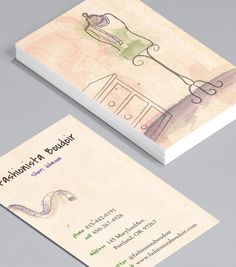 two business cards with designs on them