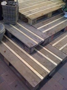 several wooden pallets stacked on top of each other