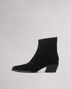 The Joni. Our ankle boot is crafted in studded suede with a squared-off pointed toe and set atop a stacked heel. Crafted with dual-density antimicrobial foam insoles: OrthoLite® Lazy-Hybrid™ for custom-fit comfort, and OrthoLite® Recycled for stability and support. Black Suede 37 Suede Ankle Boots Black, Studded Suede Ankle Boots, Edgy Studded Pointed-toe Boots, Black Suede Boots With 4-inch Heel, Embellished Black Ankle-high Boots, Women Footwear, Studded Ankle Boots, Going Out Looks, Athletic Fits