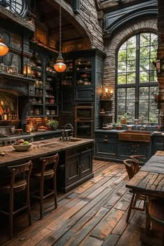 an old fashioned kitchen with wooden floors and large windows