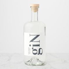 a bottle of gin on a marble surface