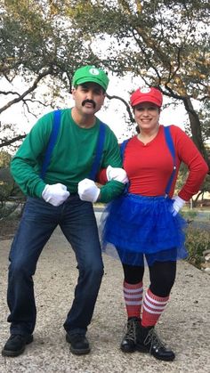 a man and woman dressed up as mario and luigi