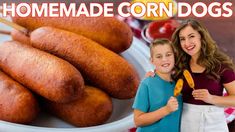 a woman and boy standing in front of a plate of corn dogs with the words homemade corn dogs on it