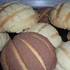 several different types of pastries sitting on a plate together in front of each other