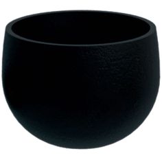 a black bowl sitting on top of a white table