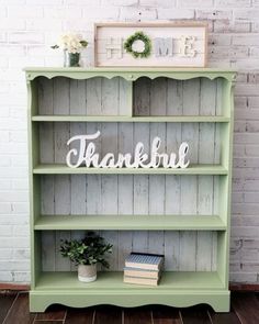 a green bookcase with the words thank you on it