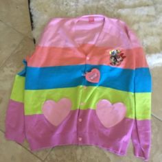 Cakeworthy Stretch Knit Embroidered Sold Out Powerpuff Girls Oversized Cardigan Size 2xl Brand New The Cardigan Of Our Dreams Is Finally Here! Look Like The Most Darling Member Of Townsville In Our Powerpuff Girls Heart Cardigan. Featuring Five Stunning Pastel Stripes, Heart Shaped Pockets, And Blossom, Buttercup, And Bubbles Embroidered On The Front! Even The Buttons Are Heart Shaped- We Can’t Get Enough Of This One! Unisex Fit Heart Pocket 100% Cotton Powerpuff Girls Licensed Product : Cute Multicolor Long Sleeve Sweater, Playful Long Sleeve Knit Cardigan, Cute Crew Neck Cardigan, Cute Pink V-neck Outerwear, Pink Long Sleeve Cotton Cardigan, Pink V-neck Cotton Outerwear, Playful Pink Cardigan For Fall, Playful Pink Cotton Sweater, Cute Pink Knit Outerwear