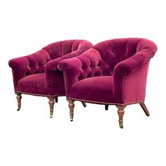 two pink velvet chairs with wooden legs