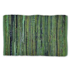 a rug with green and black stripes on it