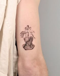 a woman's arm with a tattoo on it