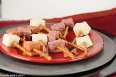 a red plate topped with food on top of a table