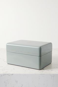 a gray box sitting on top of a white counter