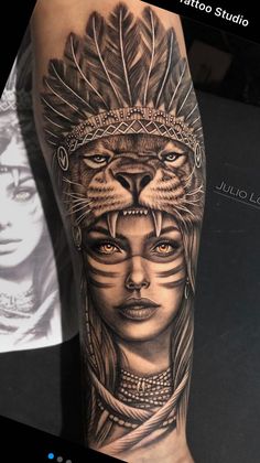 a woman with a cat's head and feathers on her body is shown in this tattoo