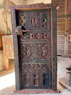 an old wooden door with intricate carvings on it