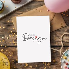 a card that says your design on it next to some cupcakes and balloons