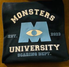 a black bag with monsters university on it