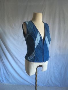 a mannequin wearing a blue vest with white stripes