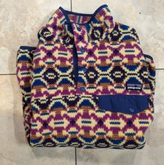 Synchilla Snap-T Fleece Pullover Perfect For Cozy Summer Nights And Camping Women's Patagonia Super Cozy Great For The Colder Months! Size Small. True To Size With A Relaxed Bit Of Room To Spare. Will Fit More Fitted On A Medium Person. Vintage / Discontinued Hard To Find Style Pattern Colorway. ( Aberdeen Butterfly ) Purple And Gold Geometric Aztec Patterns. Still Extremely Soft Like When New. Gently Used, Excellent Condition. No Visible Flaws. Elastic Cuffs And Waist Still Stretch. Photos Are Cozy Summer, Find Style, Butterfly Purple, Patagonia Synchilla, Women Camping, Aztec Pattern, Gold Geometric, Patagonia Womens, Summer Nights